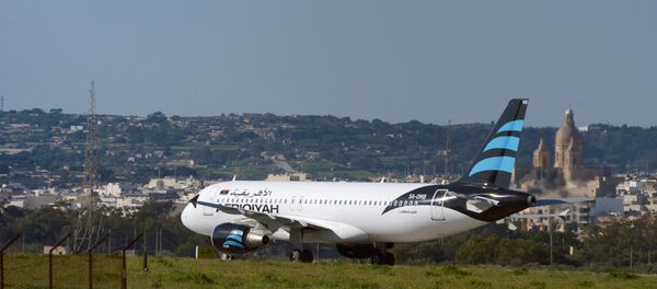 Hijacked Airbus A320 operated by Afriqiyah Airways after it landed at Luqa Airport, in Malta Hijacked Airbus A320 operated by Afriqiyah Airways after it landed at Luqa Airport, in Malta - Sputnik International