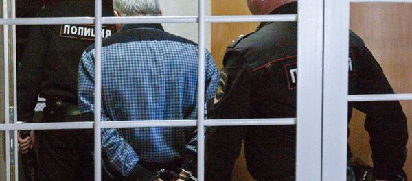 A suspect arrested in the case of mass poisoning with a Hawthorn bath lotion is seen here in Irkutsk's Leninsky district court which considers his pre-trial detention - Sputnik International