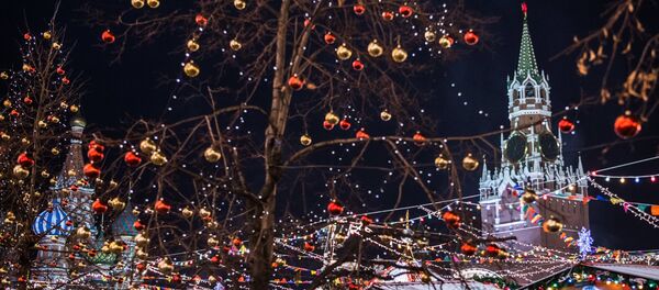 Festive illumination and the Spasskaya Tower of the Moscow Kremlin in Red Square Festive illumination and the Spasskaya Tower of the Moscow Kremlin in Red Square - Sputnik International