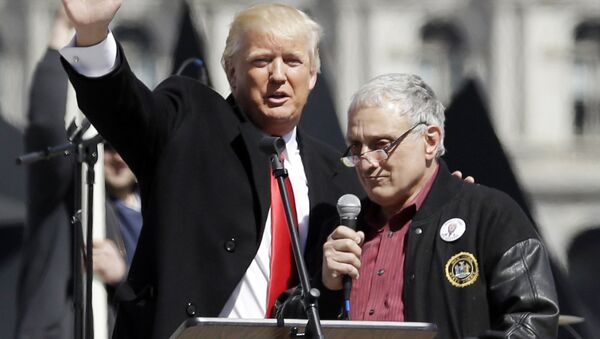 FILE - In this April 1, 2014, file photo, Donald Trump, left, is joined by Carl Paladino during a gun rights rally at the Empire State Plaza in Albany, N.Y. Paladino, who co-chaired president-Elect Donald Trump's state campaign, confirmed to The Associated Press on Friday, Dec. 23, 3016 that he told a New York alternative newspaper he hoped President Barack Obama would die from mad cow disease and that the first lady would return to being a male. - Sputnik International