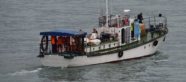 A rescue operation on the Black Sea coast at the crash site of Russian Defense Ministry's TU-154 aircraft - Sputnik International
