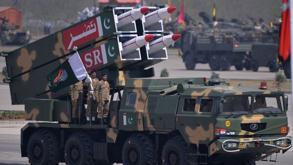 Pakistani military personnel stand beside short-range Surface to Surface Missile NASR during the Pakistan Day military parade in Islamabad on March 23, 2015 - Sputnik International