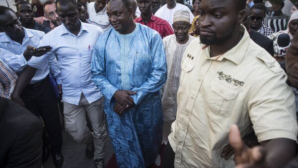 Gambia President elect, Adama Barrow, centre, walks after a meeting with Ecowas delegation in Banjul, Gambia, Tuesday, Dec. 13, 2016. Gambia's ruling party pressed for fresh elections, as West African regional mediators intervened Tuesday to try to resolve a political crisis in the tiny West African country that voted its leader of 22 years from power. (AP Photo/ Sylvain Cherkaoui) - Sputnik International