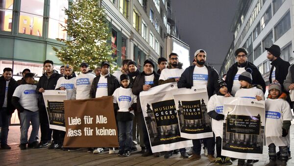 Muslims from the Ahmadiyya Muslim community commemorate the victims of the terror attack in Berlin during a vigil in Hamburg, Germany, Thursday Dec. 22, 2016 - Sputnik International