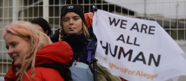 Demonstrators wait for the launch of the Civil March for Aleppo at the air field of the former airport Tempelhof in Berlin, Monday, Dec. 26, 2016 Demonstrators wait for the launch of the Civil March for Aleppo at the air field of the former airport Tempelhof in Berlin, Monday, Dec. 26, 2016 - Sputnik International