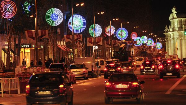 Cars pass next to Christmas lights in a street of Madrid (File) - Sputnik International