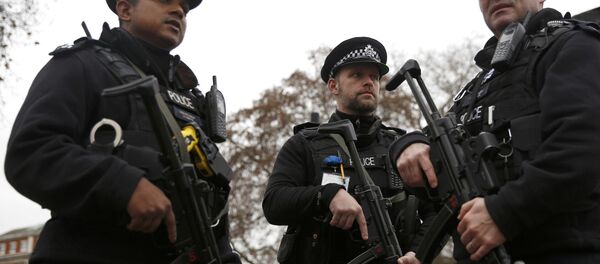 Armed police officers patrol a closed road during the Changing of the Guard ceremony at Buckingham Palace in London Armed police officers patrol a closed road during the Changing of the Guard ceremony at Buckingham Palace in London - Sputnik International