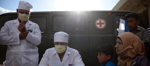 Russian doctors provide consultations to residents of Kaukab, Syria during the distribution of Russian humanitarian aid. (File) Russian doctors provide consultations to residents of Kaukab, Syria during the distribution of Russian humanitarian aid. (File) - Sputnik International