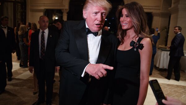 Melania Trump, right, looks on as her husband President-elect Donald Trump talks to reporters during a New Year's Eve party at Mar-a-Lago, Saturday, Dec. 31, 2016, in Palm Beach, Fla. - Sputnik International