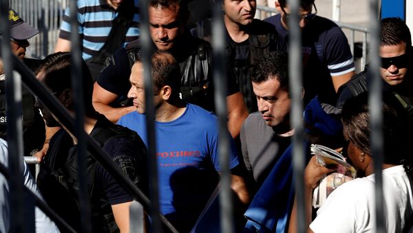 Two of the eight Turkish soldiers, who fled to Greece in a helicopter and requested political asylum after a failed military coup against the government, are escorted by special police forces after the postponement of their interviews for asylum request at the Asylum Service in Athens, Greece, July 27, 2016 - Sputnik International