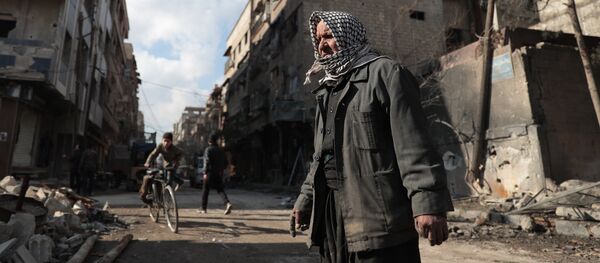 Syrian Abu Khaled looks at the rubble of his destroyed house in the rebel-held town of Douma, on the eastern outskirts of Damascus, on December 30, 2016, on the first day of a nationwide truce Syrian Abu Khaled looks at the rubble of his destroyed house in the rebel-held town of Douma, on the eastern outskirts of Damascus, on December 30, 2016, on the first day of a nationwide truce - Sputnik International