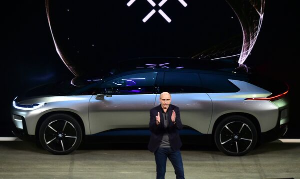 araday Future's Nick Sampson, SVP of R&D + Engineering speaks in front of the just introduced FF91 electric vehicle at the company's press conference at the 2017 Consumer Electronics Show in Las Vegas, January, 2016. - Sputnik International