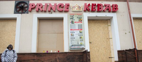 A man stands in front of the kebab shop where a 21-year old man was stabbed to death during new year's eve in a brawl with shop workers, in Elk, Poland January 2, 2017 A man stands in front of the kebab shop where a 21-year old man was stabbed to death during new year's eve in a brawl with shop workers, in Elk, Poland January 2, 2017 - Sputnik International