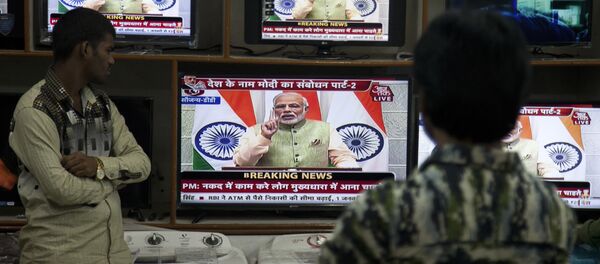 People watch Indian Prime Minister Narendra Modi addressing the nation, on television in Hyderabad, India, Saturday, Dec. 31, 2016 People watch Indian Prime Minister Narendra Modi addressing the nation, on television in Hyderabad, India, Saturday, Dec. 31, 2016 - Sputnik International
