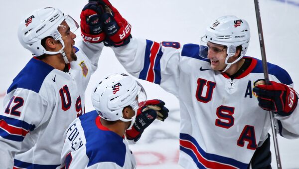 US players Jordan Greenway, Eric Foley and Colin White celebrate winning in the IIHF World Junior Championship semifinals between the national teams of US and Russia - Sputnik International