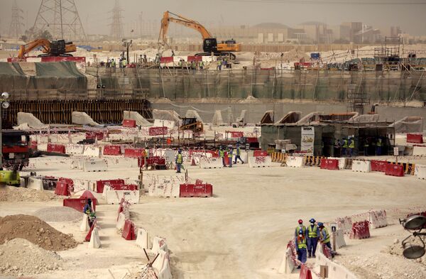 Laborers work at the Al-Wakra Stadium that is under construction for the 2022 World Cup, in Doha, Qatar. Laborers work at the Al-Wakra Stadium that is under construction for the 2022 World Cup, in Doha, Qatar. - Sputnik International