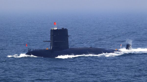 In this April 26, 2012 file photo released by China's Xinhua News Agency, Chinese navy's submarine attends the fleet review of the China-Russia joint naval exercise in the Yellow Sea - Sputnik International