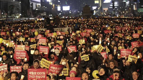 Protesters shout slogans during a candle light vigil calling for impeached President Park Geun-hye to step down in Seoul, South Korea - Sputnik International