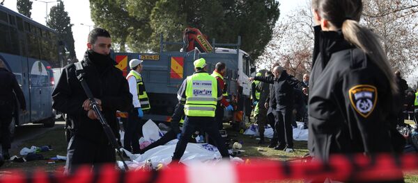 Israeli Zaka volunteers examine a body of one of the four Israeli soldiers killed when a Palestinian truck driver ran into the group at the Jerusalem promenade Israeli Zaka volunteers examine a body of one of the four Israeli soldiers killed when a Palestinian truck driver ran into the group at the Jerusalem promenade - Sputnik International