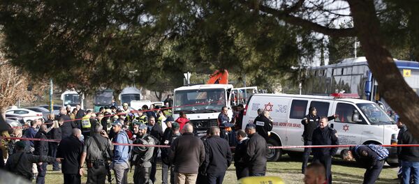 Israeli security forces and emergency personnel gather at the site of a vehicle-ramming attack in Jerusalem Israeli security forces and emergency personnel gather at the site of a vehicle-ramming attack in Jerusalem - Sputnik International
