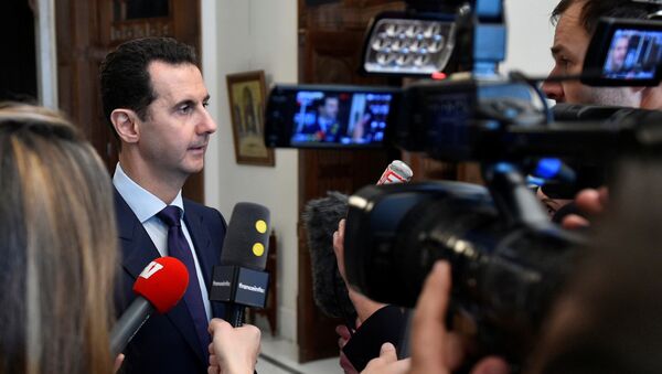 Syria's President Bashar al-Assad speaks to French journalists in Damascus, Syria, in this handout picture provided by SANA on January 9, 2017 - Sputnik International