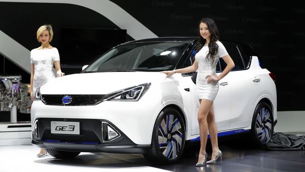 Models pose with the GAC Motors GE3 electric car at the North American International Auto Show in Detroit, Monday, Jan. 9, 2017.  - Sputnik International