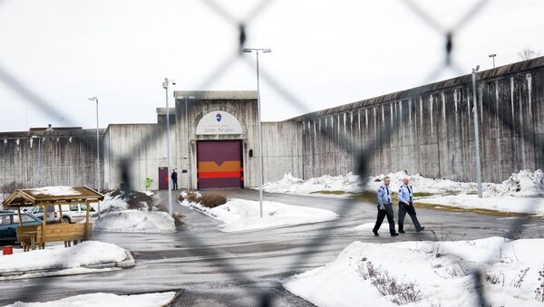 Prison guards walk on March 14, 2016 outside Skien prison, some 130 km south west of Oslo, where Norwegian mass killer Anders Behring Breivik has been serving his sentence since September 2013. - Sputnik International