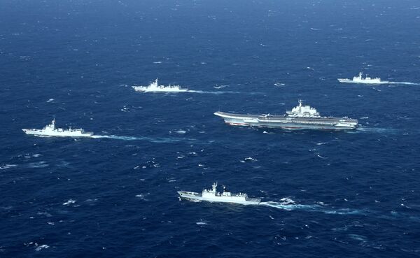 China's Liaoning aircraft carrier with accompanying fleet conducts a drill in an area of South China Sea in this undated photo taken December, 2016 China's Liaoning aircraft carrier with accompanying fleet conducts a drill in an area of South China Sea in this undated photo taken December, 2016 - Sputnik International