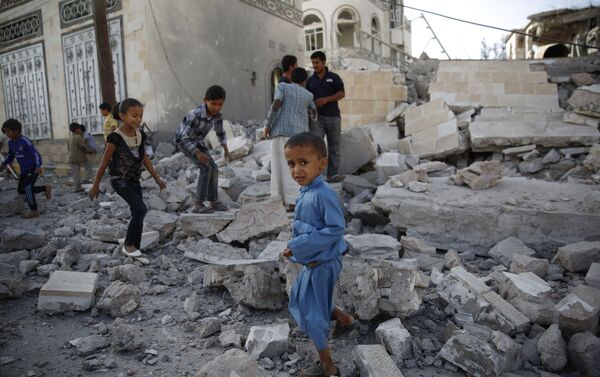 In this Sept. 8, 2015 file photo, children play amid the rubble of a house destroyed by a Saudi-led airstrike in Sanaa, Yemen - Sputnik International