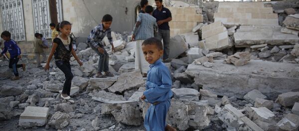 In this Sept. 8, 2015 file photo, children play amid the rubble of a house destroyed by a Saudi-led airstrike in Sanaa, Yemen In this Sept. 8, 2015 file photo, children play amid the rubble of a house destroyed by a Saudi-led airstrike in Sanaa, Yemen - Sputnik International