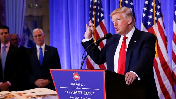Vice President-elect Mike Pence is seen in the background as U.S. President-elect Donald Trump speaks during a press conference in Trump Tower, Manhattan, New York, U.S., January 11, 2017 - Sputnik International