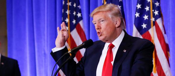 Vice President-elect Mike Pence is seen in the background as U.S. President-elect Donald Trump speaks during a press conference in Trump Tower, Manhattan, New York, U.S., January 11, 2017 - Sputnik International