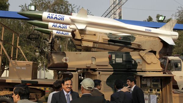 Visitors discuss in front of Defence Research & Development Organization's Akash medium range surface to air missile system, at the DefExpo-India 2010 , in New Delhi, India, Tuesday, Feb. 16, 2010 - Sputnik International