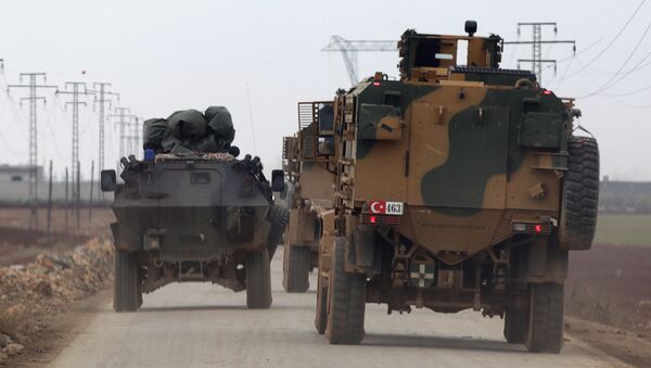 Turkish military vehicles drive in the Syrian rebel-held town of al-Rai, as they head towards the northern Syrian town of al-Bab, Syria January 4, 2017 - Sputnik International