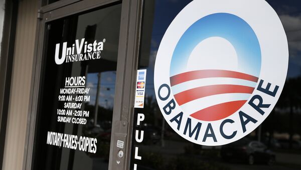 An Obamacare logo is shown on the door of the UniVista Insurance agency in Miami, Florida on January 10, 2017 - Sputnik International