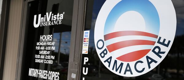 An Obamacare logo is shown on the door of the UniVista Insurance agency in Miami, Florida on January 10, 2017 - Sputnik International