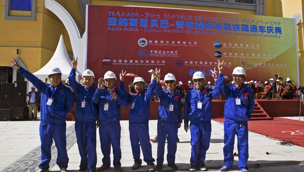Chinese workers pose at the inauguration site of a train linking Addis Ababa to Djibouti, 20 kilometres from the centre of Addis Ababa on October 5, 2016 - Sputnik International