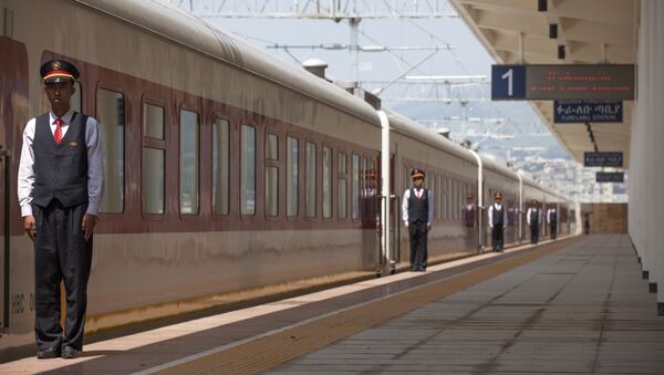Chinese employees of the Addis Ababa / Djibouti train line stand at the Feri train station in Addis Ababa on September 24, 2016. With Chinese conductors at the helm, a fleet of shiny new trains will on October 5, 2016 begin plying a new route from the Ethiopian capital to Djibouti, in a major boost to both economies - Sputnik International