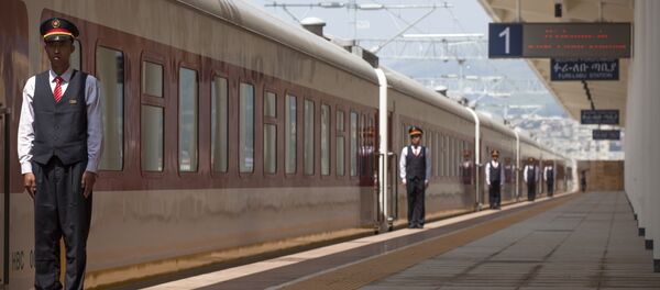 Chinese employees of the Addis Ababa / Djibouti train line stand at the Feri train station in Addis Ababa on September 24, 2016. With Chinese conductors at the helm, a fleet of shiny new trains will on October 5, 2016 begin plying a new route from the Ethiopian capital to Djibouti, in a major boost to both economies Chinese employees of the Addis Ababa / Djibouti train line stand at the Feri train station in Addis Ababa on September 24, 2016. With Chinese conductors at the helm, a fleet of shiny new trains will on October 5, 2016 begin plying a new route from the Ethiopian capital to Djibouti, in a major boost to both economies - Sputnik International