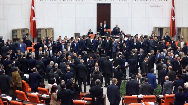 Turkish lawmakers cast their votes during a debate for a proposal for change in the constitution on January 10, 2017 at the Turkish parliament in Ankara. Turkey's parliament on January 9, 2017 began debating a controversial new draft constitution aimed at expanding the powers of the presidency under Recep Tayyip Erdogan - Sputnik International