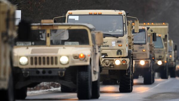 US military vehicles make their way on an army training camp near Brueck, northeastern Germany, on January 11, 2017 - Sputnik International