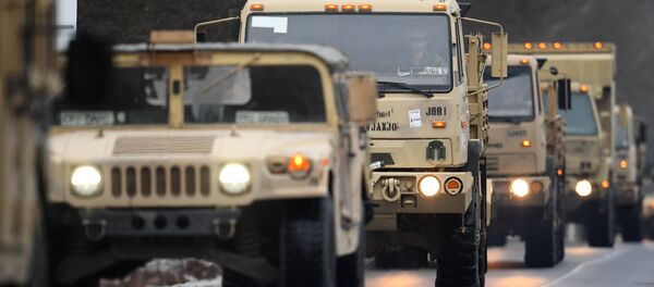 US military vehicles make their way on an army training camp near Brueck, northeastern Germany, on January 11, 2017 US military vehicles make their way on an army training camp near Brueck, northeastern Germany, on January 11, 2017 - Sputnik International