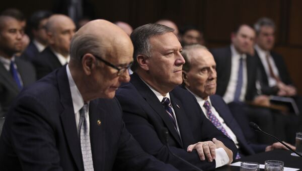 CIA Director-designate Rep. Michael Pompeo, R-Kan., center, flanked by former Senate Majority Leader Bob Dole, right, and Sen. Pat Roberts, R-Kan., listens on Capitol Hill in Washington, Thursday, Jan. 12, 2017, at his confirmation hearing before the Senate Intelligence Committee - Sputnik International