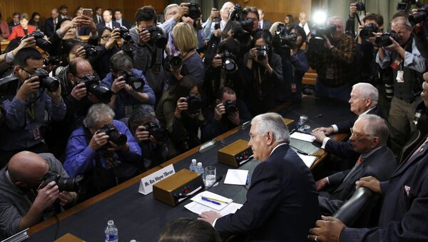 Rex Tillerson (C), former chairman and chief executive officer of Exxon Mobil, is seated prior to testifying before a Senate Foreign Relations Committee confirmation hearing on his nomination to be U.S. secretary of state, on Capitol Hill in Washington, U.S. January 11, 2017 - Sputnik International
