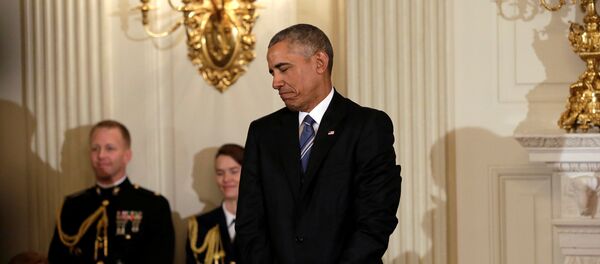 U.S. President Barack Obama reacts after presenting the Presidential Medal of Freedom to Vice President Joe Biden (not pictured) in the State Dining Room of the White House in Washington, U.S., January 12, 2017 - Sputnik International