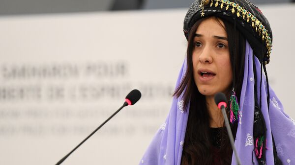 Nadia Murad , public advocates for the Yazidi community in Iraq and survivors of sexual enslavement by the Islamic State jihadists delivers a speech after being awarded co-laureate of the 2016 Sakharov human rights prize, on December 13, 2016 at the European parliament in Strasbourg - Sputnik International