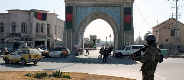 An Afghan National Army (ANA) soldier stands guard near the Kandahar governor guest house building where a bomb blast killed mainly government officials or diplomats from the United Arab Emirates, in Kandahar, Afghanistan January 11, 2017 - Sputnik International