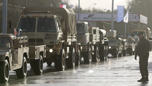 U.S. Army vehicles cross the Polish border in Olszyna, Poland, Thursday, Jan. 12, 2017 heading for their new base in Zagan - Sputnik International