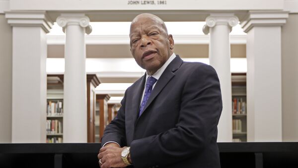Rep. John Lewis, D-Ga., poses for a photograph under a quote of his that is displayed in the Civil Rights Room in the Nashville Public Library Friday, Nov. 18, 2016, in Nashville, Tenn.  - Sputnik International