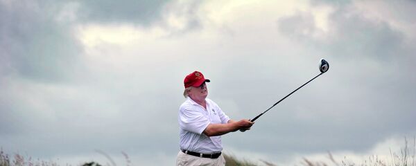 Donald Trump plays a stroke as he officially opens his new multi-million pound Trump International Golf Links course in Aberdeenshire, Scotland, on July 10, 2012 Donald Trump plays a stroke as he officially opens his new multi-million pound Trump International Golf Links course in Aberdeenshire, Scotland, on July 10, 2012 - Sputnik International